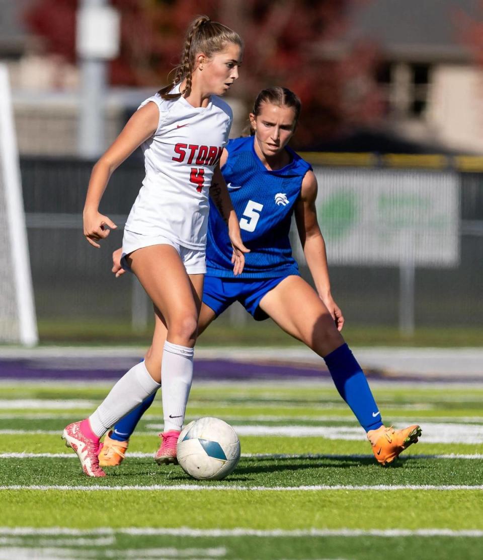Owyhee’s Alexa Zierenberg dribbles past Timberline’s Maura Walters during the 5A girls soccer state tournament semifinals, Friday, Oct. 20, 2023 at Rocky Mountain High School.