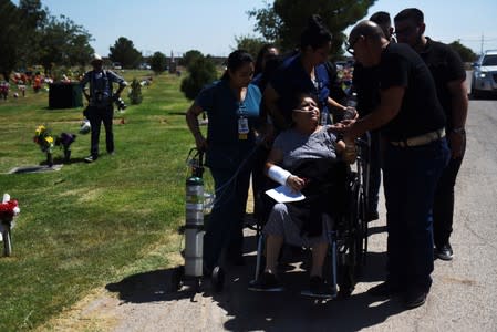 Friends and family gather for a burial, six days after a mass shooting in El Paso