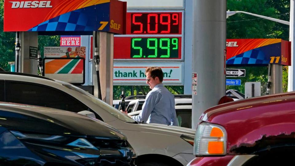 A man pumps gas at a mini-mart in Pittsburgh on Wednesday, June 15, 2022. (AP Photo/Gene J. Puskar)