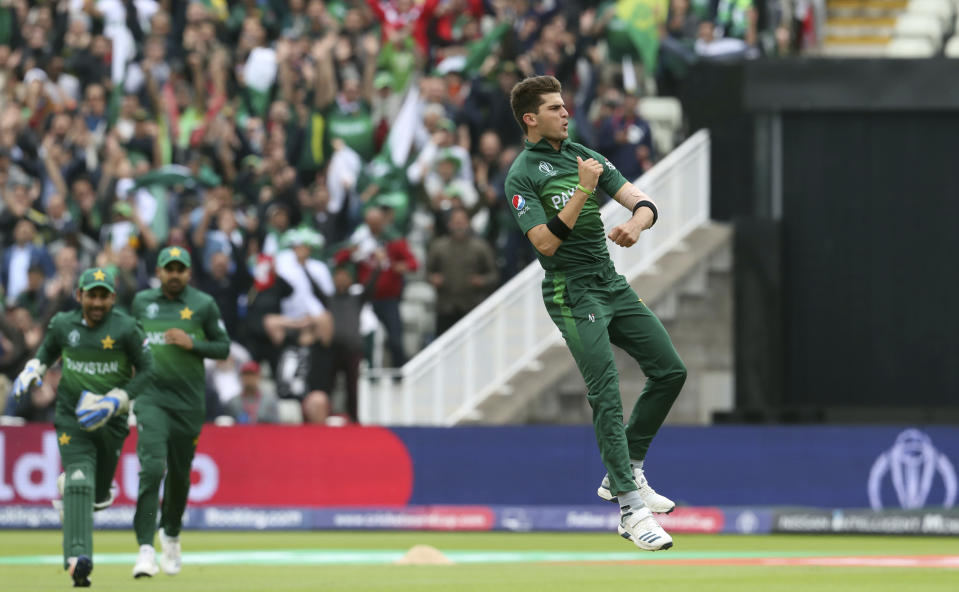 Pakistan's bowler Shaheen Afridi jumps as he celebrates after dismissing New Zealand's batsman Colin Munro for 12 runs during the Cricket World Cup match between New Zealand and Pakistan at the Edgbaston Stadium in Birmingham, Wednesday, June 26, 2019. (AP Photo/Rui Vieira)