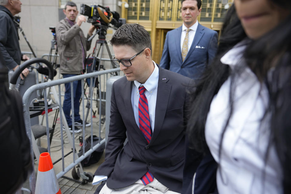 Brian Kolfage leaves court after being sentenced for defrauding donors to the "We Build the Wall" effort, Wednesday, April 26, 2023, in New York. The co-founder of a fundraising group linked to Steve Bannon that promised to help Donald Trump construct a wall along the southern U.S. border has been sentenced to four years and three months in prison. (AP Photo/John Minchillo)