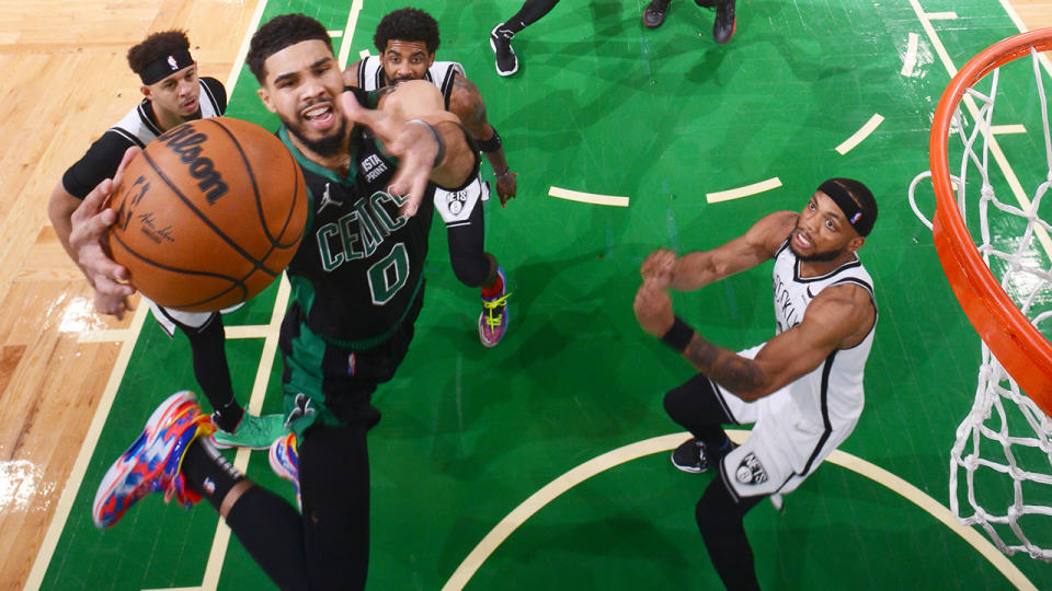 Jayson Tatum's spinning, buzzer-beating layup handed the Boston Celtics their first win of the NBA playoffs. (Photo by Brian Babineau/NBAE via Getty Images)