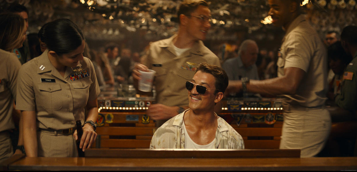 This image released by Paramount Pictures shows Monica Barbaro, left, and Miles Teller in "Top Gun: Maverick." (Paramount Pictures via AP)