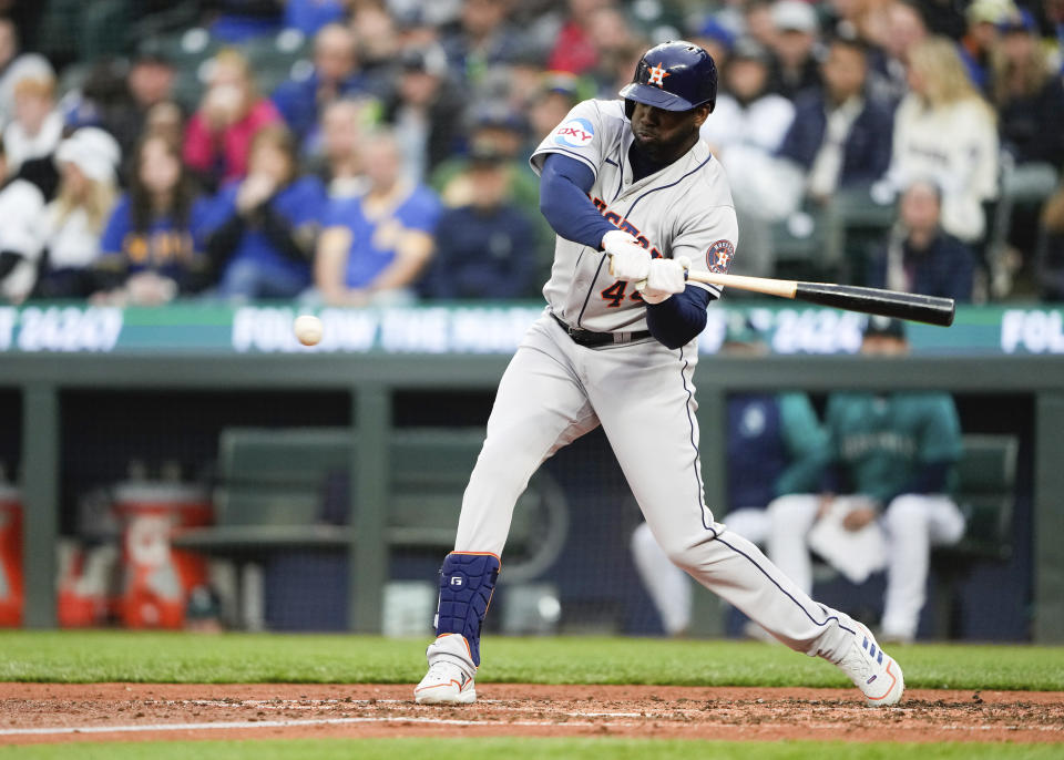 Houston Astros' Yordan Alvarez hits an RBI double against the Seattle Mariners during the fifth inning of a baseball game Saturday, May 6, 2023, in Seattle. (AP Photo/Lindsey Wasson)