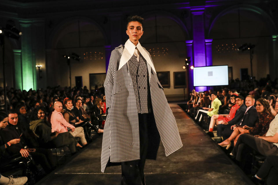 The Devonation by Devon Yan collection is modeled during the dapperQ fashion show at the Brooklyn Museum on Thursday, Sept. 5, 2019, in New York. (AP Photo/Jeenah Moon)