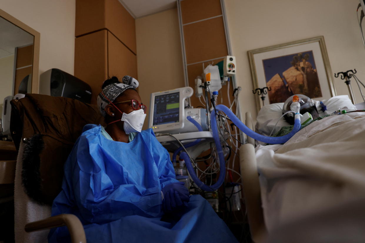 Sandie Bushnur, a hospital sitter, provides companionship and observation for patients in the ICU at St. Mary Medical Center in Apple Valley, Calif