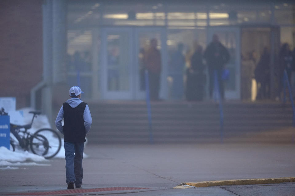 A student arrives at Perry Middle School, Thursday, Jan. 25, 2024, in Perry, Iowa. Middle school students returned to classes Thursday for the first time since a high school student opened fire in a shared cafeteria, killing two people and injuring six others. (AP Photo/Charlie Neibergall)