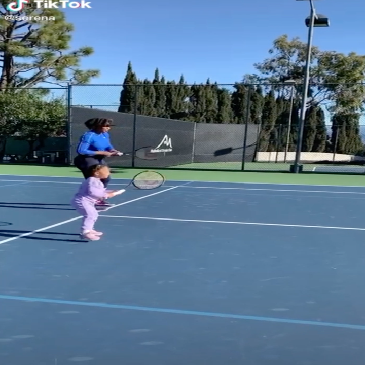 Serena and Olympia playing tennis together