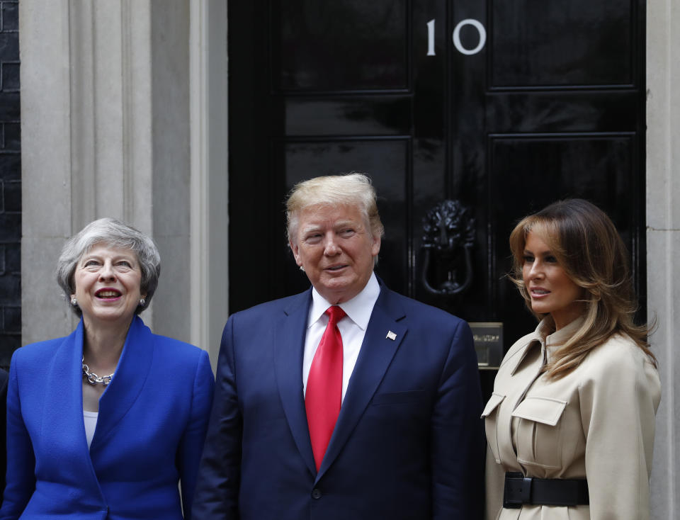 Britain's Prime Minister Theresa May welcomes President Donald Trump and first lady Melania, right, outside 10 Downing Street in central London, Tuesday, June 4, 2019. President Donald Trump will turn from pageantry to policy Tuesday as he joins British Prime Minister Theresa May for a day of talks likely to highlight fresh uncertainty in the allies' storied relationship. (AP Photo/Alastair Grant)