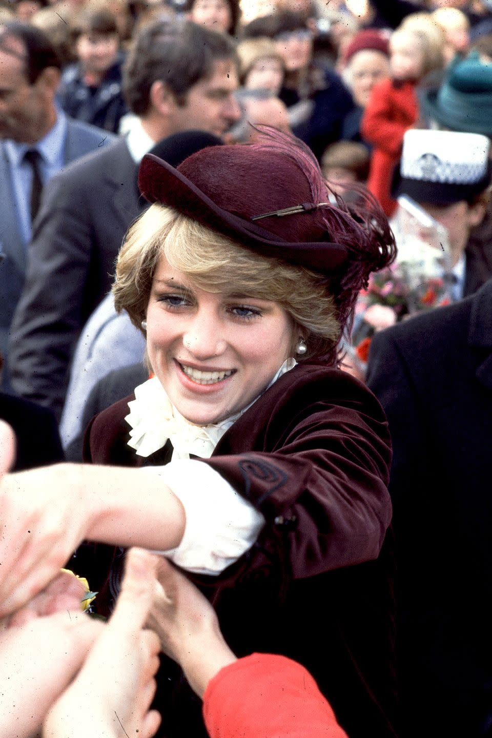 <p>In a plum John Boyd hat while greeting crowds.</p>