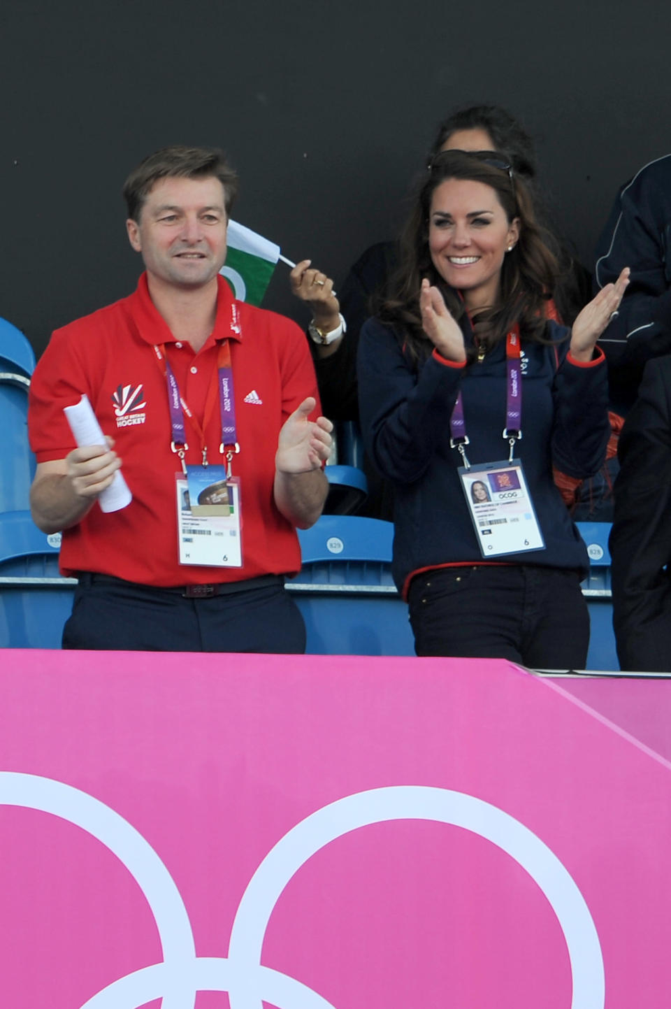 This navy sweater with red accents is a good example of comfort and style. Kate wore this outfit to an Olympic hockey game on August 3.