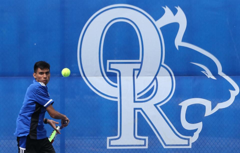 Oyster River's Shashu Srivatsan returns a shot at No. 2 singles in Thursday's Division II boys tennis quarterfinal against Winnacunnet.