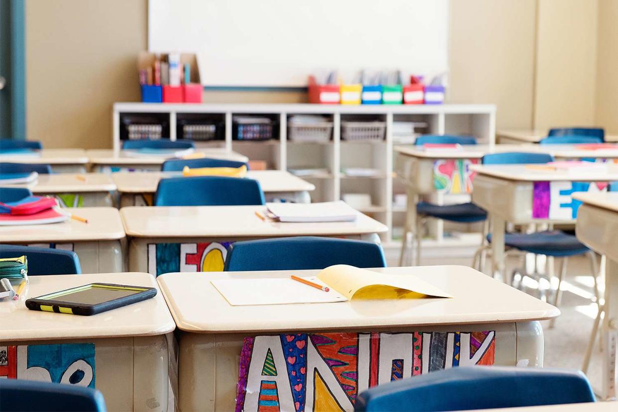 Classroom without children at school's out. The desks are in rows and you can read the names of the children on the front of the desks drawn in multicolour. Photo was taken in elementary school in Quebec Canada.