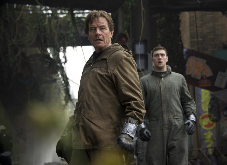 This image released by Warner Bros. Pictures shows Bryan Cranston, left, and Aaron Taylor-Johnson in a scene from "Godzilla." (AP Photo/Warner Bros. Pictures, Kimberley French)