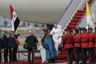 Pope Francis arrives at Baghdad's international airport, Iraq, Friday, March 5, 2021. Pope Francis heads to Iraq on Friday to urge the country's dwindling number of Christians to stay put and help rebuild the country after years of war and persecution, brushing aside the coronavirus pandemic and security concerns. (AP Photo/Andrew Medichini)