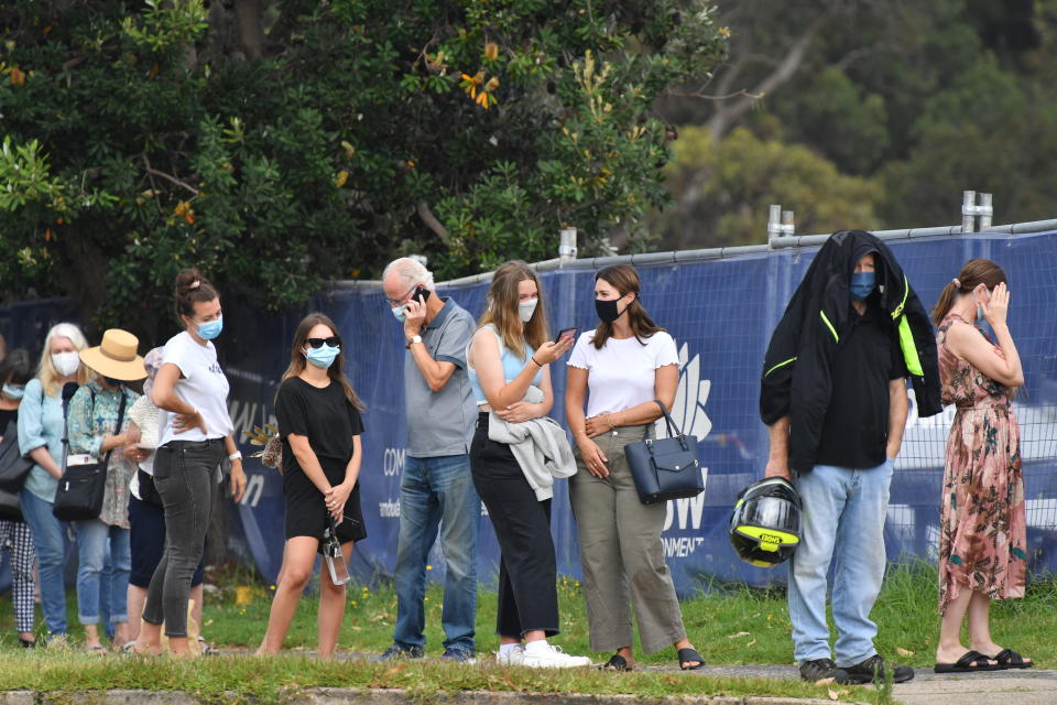 People line up for Covid-19 testing at Mona Vale Hospital's walk-in clinic in Sydney. Source: AAP