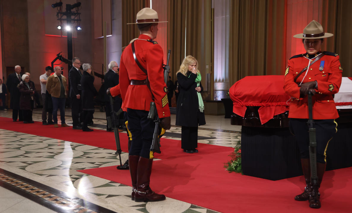 Members of the public pay their respects at the casket of former prime minister Brian Mulroney as he lies in state at the Sir John A. Macdonald Building, across from Parliament Hill in Ottawa on Tuesday, March 19, 2024. THE CANADIAN PRESS/ Patrick Doyle