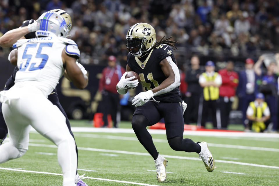 New Orleans Saints running back Alvin Kamara rushes for a 2-yard touchdown during the second half of an NFL football game against the Detroit Lions, Sunday, Dec. 3, 2023, in New Orleans. (AP Photo/Butch Dill)