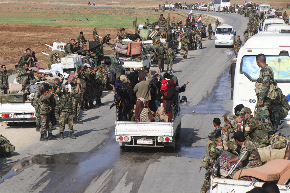 Syrian government forces reinforcements arrive near the city of Ras al-Ayn, in the north of Syria, Saturday, Oct. 26, 2019. (AP Photo)