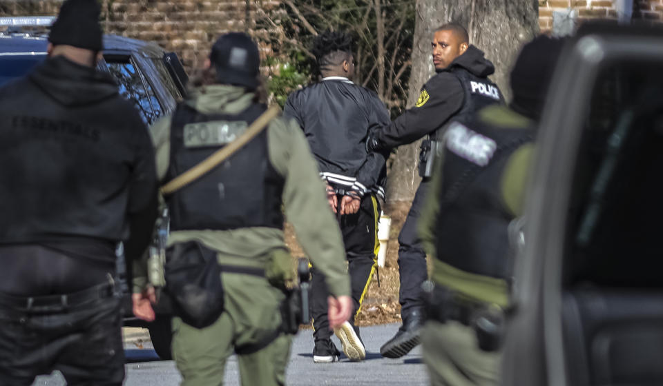 Multiple people are in custody after a shots fired call expedited a suspected trafficking investigation at a home in South Fulton, Ga., Thursday morning, Feb. 1, 2024. Police in an Atlanta-area city responding to shots fired at a home on Thursday found numerous women there and are investigating the possibility the residence was used for sex trafficking, authorities said. (John Spink/Atlanta Journal-Constitution via AP)