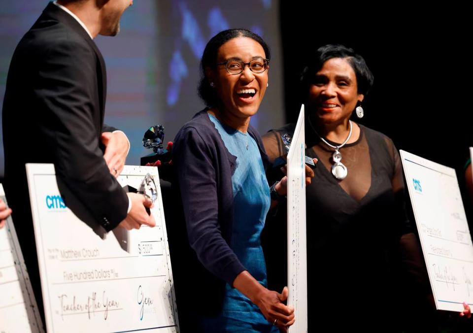 Phillip O. Berry Academy of Technology teacher Ana Cunningham, center, smiles as she is announced as Charlotte Mecklenburg School teacher of the year.