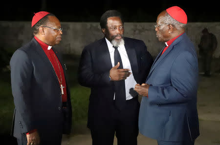 FILE PHOTO: Democratic Republic of Congo's President Joseph Kabila talks with religious leaders after a meeting with coalition members at his farm in Kingakati outside Kinshasa, Democratic Republic of Congo, August 7, 2018. REUTERS/Kenny Katombe/File Photo