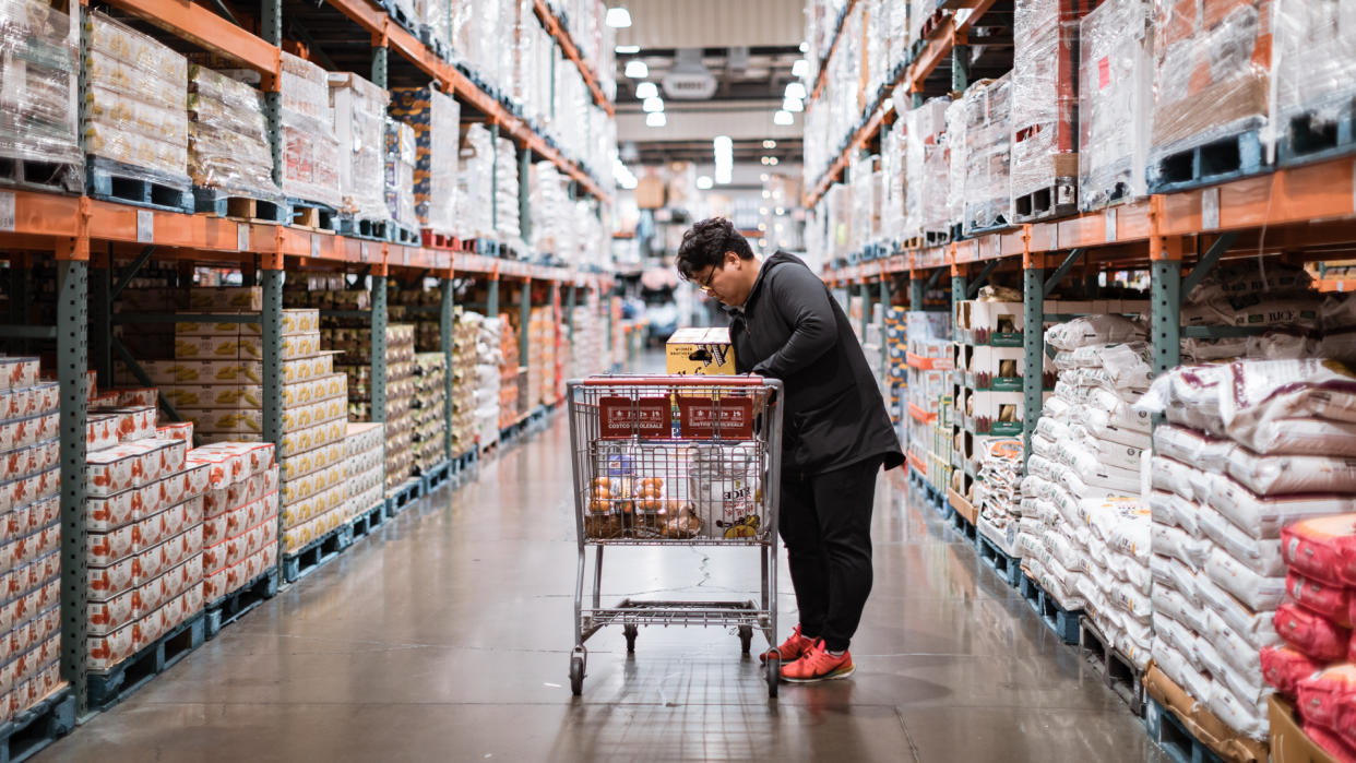 Tigard, Oregon - Nov 8, 2019 : People with carts in Costco Wholesale.