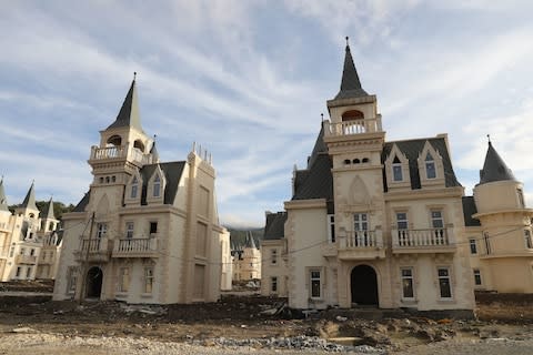 Burj Al Babas contains more than 700 Gothic-style villas, each resembling an identikit miniature castle - Credit: AFP