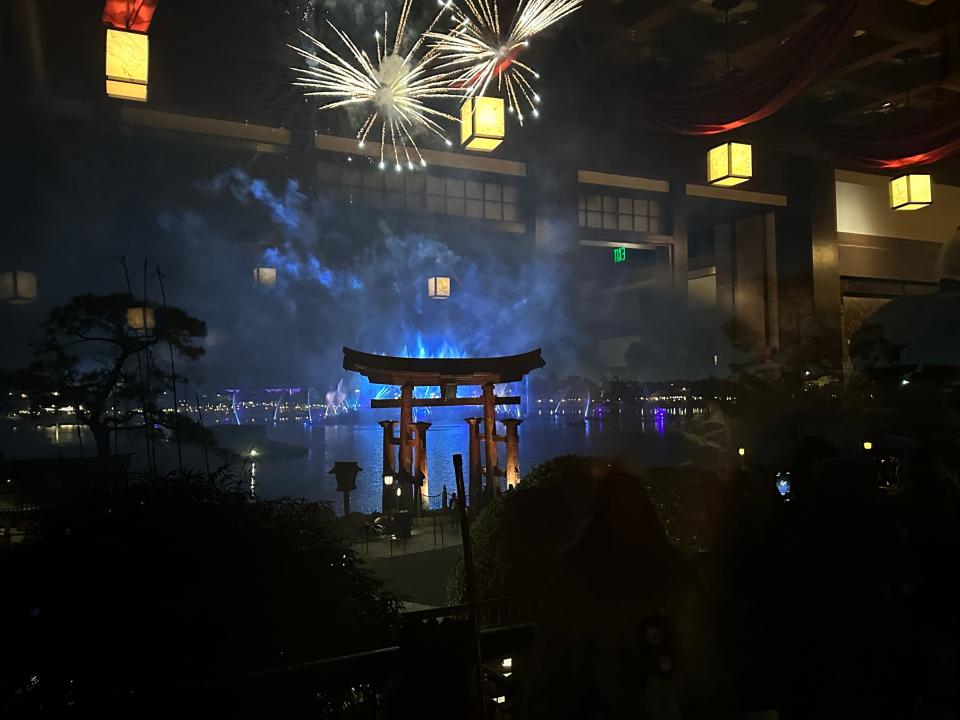 view of epcot's firework show from the restaurant in the japan pavilion