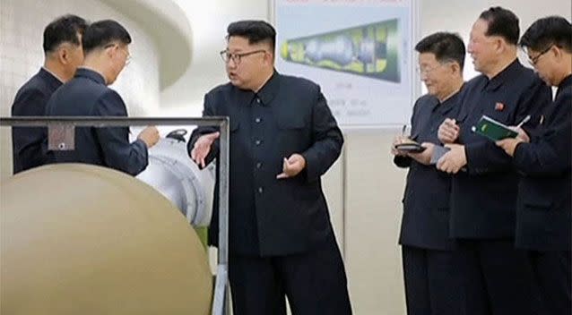 Dictator Kim Jong-un inspects ordnance in a photo released by North Korea's state-run media.