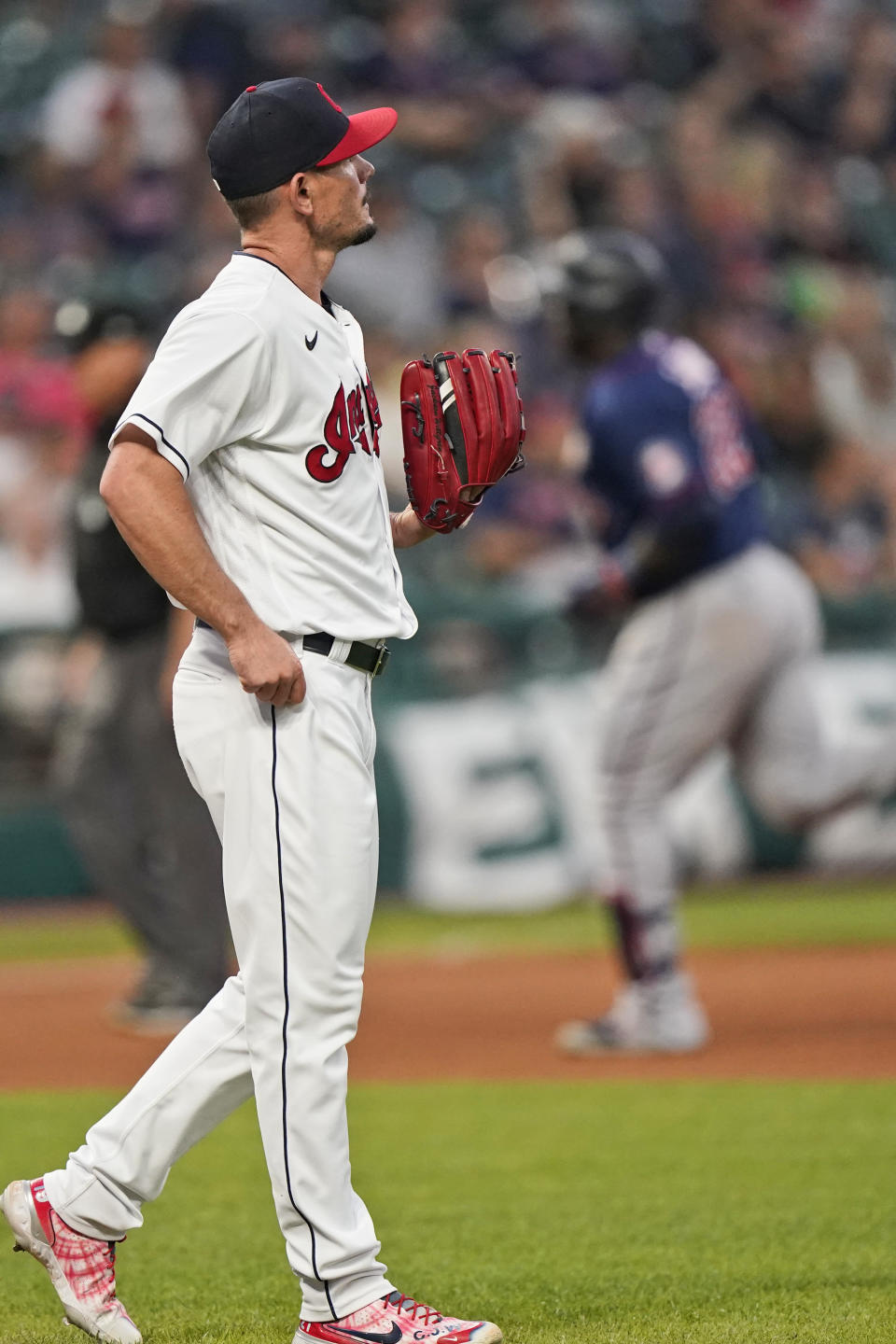 Cleveland Indians relief pitcher Nick Wittgren waits for Minnesota Twins' Miguel Sano to run the bases after Sano hit a solo home run during the seventh inning of a baseball game Wednesday, Sept. 8, 2021, in Cleveland. (AP Photo/Tony Dejak)