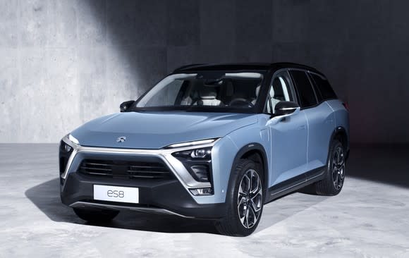 A blue-gray NIO ES8, a three-row seven-passenger electric SUV.