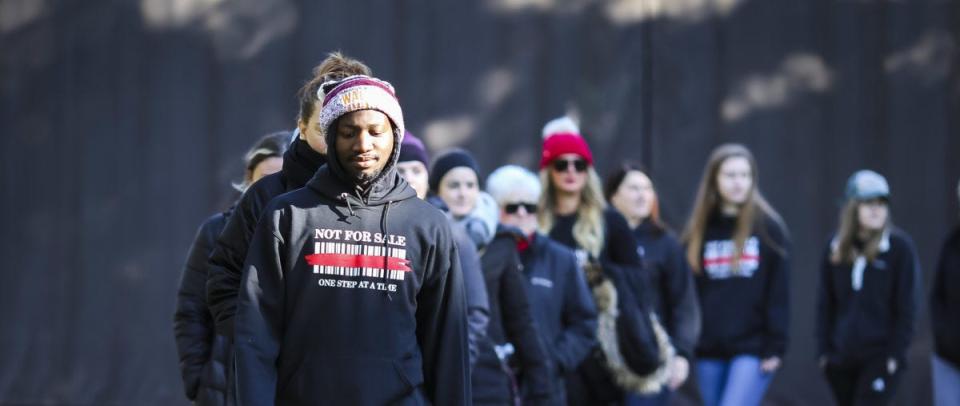 A group of students takes part in an event the group Not for Sale held at Walsh University. The group works to spotlight the issue of human trafficking and sextortion among young people.