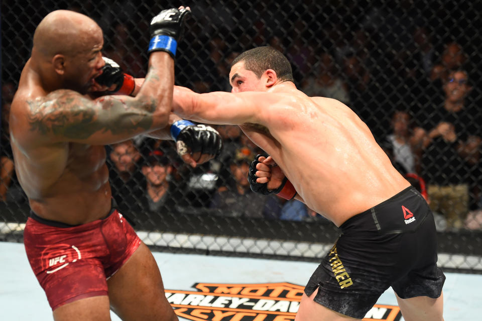 Robert Whittaker punches Yoel Romero in their middleweight fight during the UFC 225 event at the United Center on June 9, 2018 in Chicago, Illinois. (Getty Images)