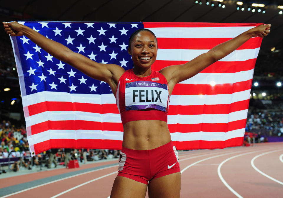 <a href="http://sports.yahoo.com/olympics/track-field/allyson-felix-1132858/" data-ylk="slk:Allyson Felix;elm:context_link;itc:0;sec:content-canvas" class="link ">Allyson Felix</a> of the United States celebrates after winning gold in the Women's 200m Final on Day 12 of the London 2012 Olympic Games at Olympic Stadium on August 8, 2012 in London, England. (Photo by Stu Forster/Getty Images)