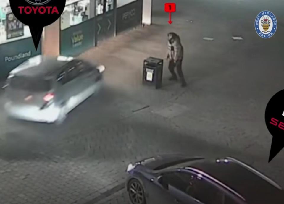 Mr Atkinson tries to hide behind a bin as a car drives straight at him (West Midlands Police)