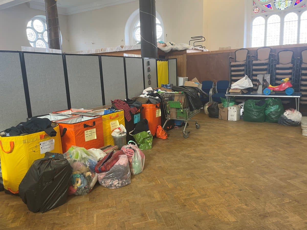 Food bank Neighbours in Poplar lies in the shadows of the towering syscrapers of Canary Wharf (The Independent)