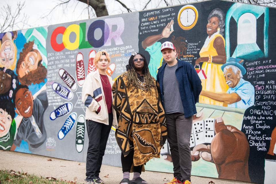 Bexx Chin, Elisheba Israel Mrozik and Robert Jones stand at the Kossie Gardner Sr. Park in Nashville, Tenn., Friday, Dec. 29, 2023. Mrozik painted the mural in the background and is the president of North Nashville Arts Coalition. Jones and Chin work at Overton Arts at the 100 Taylor Arts Collective. Metro Arts reduced funding for the coalition and collective this year.