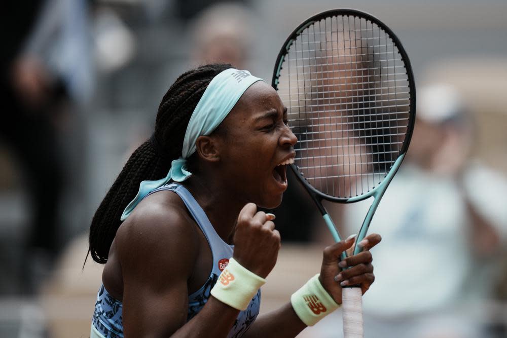 Coco Gauff of the U.S. celebrates winning against Belgium’s Elise Mertens in two sets, 6-4, 6-0, during their fourth round match at the French Open tennis tournament in Roland Garros stadium in Paris, France, Sunday, May 29, 2022. (AP Photo/Thibault Camus)