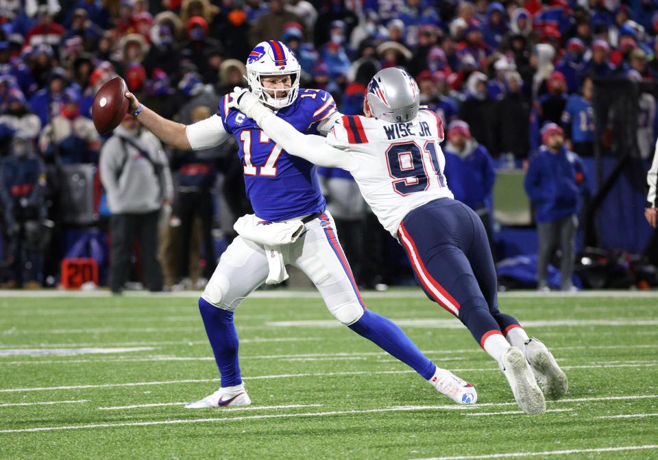 Bills quarterback Josh Allen fights off Patriots lineman Deatrich Wise Jr. during a Dec. 26 game. Wise was continuing to apply the same kind of pressure to Panthers quarterbacks during Tuesday's joint practice at Gillette Stadium.