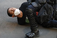 A demonstrator is taken into custody by police after a curfew took effect during a protest over the death of George Floyd, Monday, June 1, 2020, near the White House in Washington. Floyd died after being restrained by Minneapolis police officers. (AP Photo/Alex Brandon)