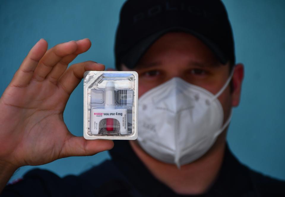 Indian Harbour Beach police officer J. Pinsker holding a dose of NARCAN. Many police departments in the county have started carrying NARCAN in their police cars to administer to people who are overdosing. 