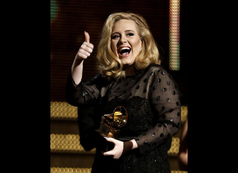 Adele accepts her Grammy award for record of the year for Rolling in the Deep