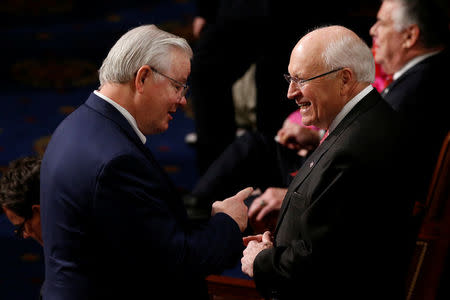 Former U.S. Vice President Dick Cheney (R) speaks with Representative Joe Barton (R-TX) in the House chamber on the first day of the new session of Congress in Washington, U.S. January 3, 2017. Cheney was in attendance because his daughter Representative Liz Cheney (R-WY) was being sworn in to serve in the House. REUTERS/Jonathan Ernst