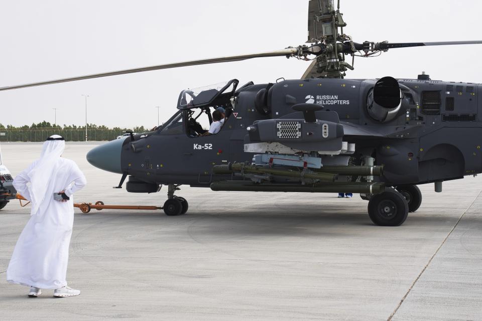 A Russian KA-52 helicopter is pulled into position at the Dubai Air Show in Dubai, United Arab Emirates, Wednesday, Nov. 15, 2023. The leader of the United Arab Emirates toured the Dubai Air Show on Wednesday as a sanctioned Russian arms supplier displayed an attack helicopter used in its war on Ukraine, highlighting his country's continued ties to Moscow despite Western sanctions targeting it. (AP Photo/Jon Gambrell)