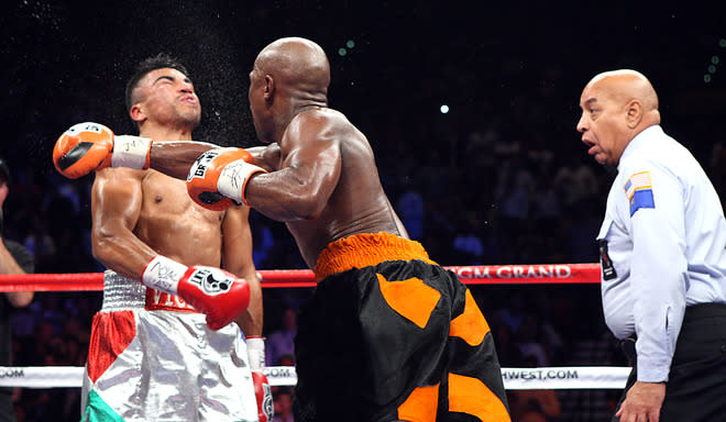 <b>The Cheap Shot Heard Round the World:</b> After referee Joe Cortez declared a foul on Victor Ortiz for headbutting, Floyd Mayweather took advantage of the lull in action in the most devastating way possible: By knocking out Ortiz with a combination. (Getty)