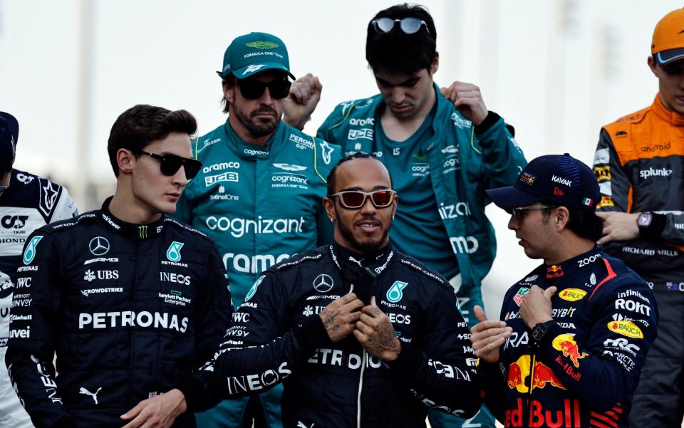 Aston Martin's Fernando Alonso, Aston Martin's Lance Stroll, Mercedes' George Russell, Mercedes' Lewis Hamilton and Red Bull's Sergio Perez during the drivers parade before the race