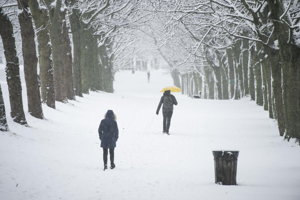 People walking through the snow in Leeds, Yorkshire.
