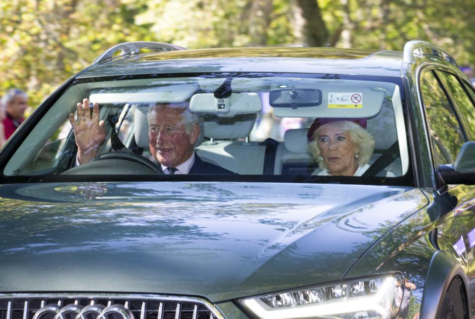 Prince Charles, Prince of Wales, and Camilla, Duchess of Cornwall, drive to Crathie Kirk Church before the service on Aug. 25.