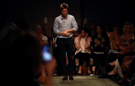 Burberry creative director Christopher Bailey acknowledges the audience at the Burberry catwalk show during London Fashion Week Spring/Summer 2017 in London, Britain September 19, 2016. REUTERS/Neil Hall